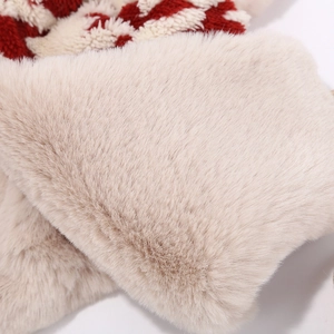 Close-up of thick beige plush lining and red houndstooth pattern on winter earflap hat