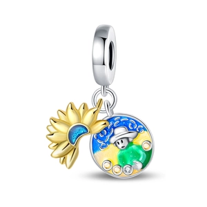 Macro detail of sunflower charm with gold finish and colorful enamel cartoon pendant