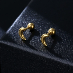 Polished gold crescent moon stud earrings with secure ball screw back on black leather