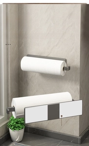 Detail of self-adhesive kitchen paper towel rack with gray metal finish on marble wall