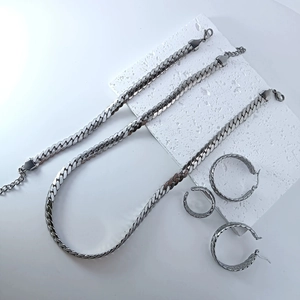 Silver stainless steel jewelry set featuring classic cuban link chains and hoop earrings