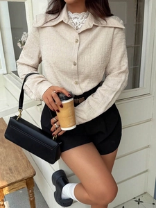 Elegant beige long sleeve blouse with textured fabric and vintage gold buttons for women