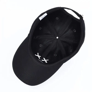 Black minimalist baseball cap with KAWS-style XX embroidery and inner stitching detail