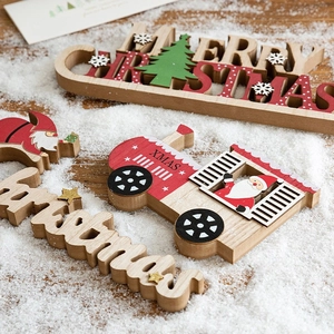 Christmas wooden reindeer and Santa ornaments set on rustic snowy background