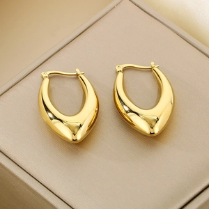 Polished gold U-shaped stainless steel earrings featuring a modern minimalist geometric design