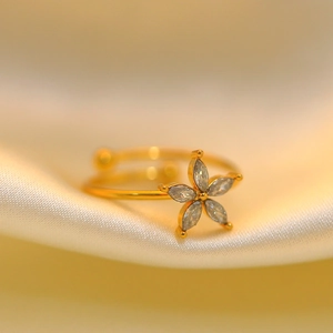 French style 18K gold plated stainless steel ring with zircon flower on silk fabric