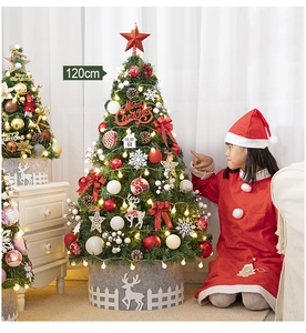 Close-up of a 120cm green Christmas tree with colorful ornaments and warm LED lights