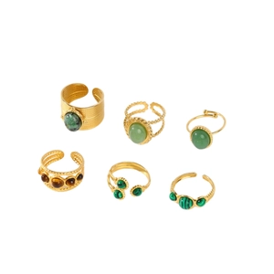 Set of six gold-plated adjustable rings featuring green and brown gemstones on white background