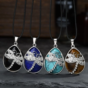 Detail of dragonfly teardrop necklaces in four colors with crystal accents on black cord