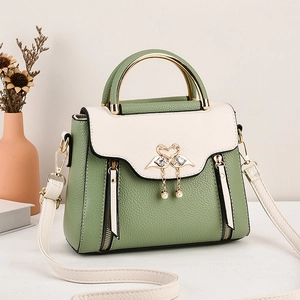 Green and white faux leather crossbody bag with swan metal ornament and pearl charm