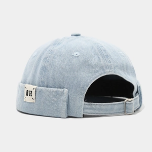 Light blue denim docker cap with GR patch and adjustable metal buckle back view