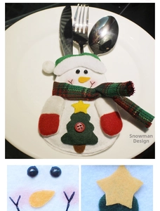 Macro detail of snowman cutlery holder showing felt texture and star pattern