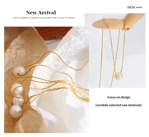 Detailed view of gold titanium steel necklace with natural freshwater pearl pendant