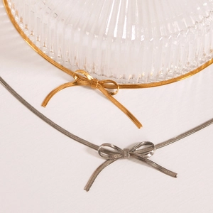 Minimalist 18K gold and silver stainless steel flat snake chains with bow pendants