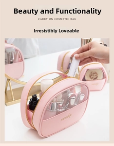Pink PU leather and transparent PVC crescent makeup bag showing storage of cosmetics