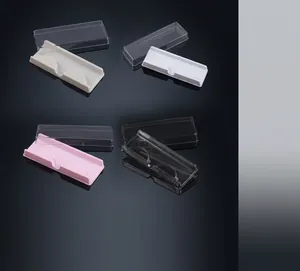 Detail view of colorful eyelash packaging boxes in beige, white, pink and transparent