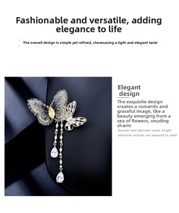 Détail de la broche papillon avec pierres en zircon et élégantes chaînettes à glands