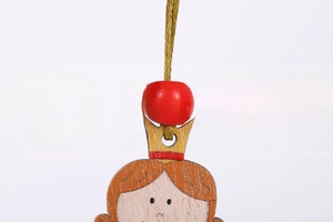 Detailed view of hand-painted wooden angel ornament with red beads for Christmas tree