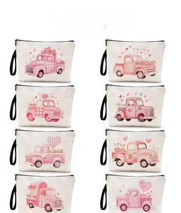Detailed pattern display of eight canvas makeup bags with pink truck and floral designs