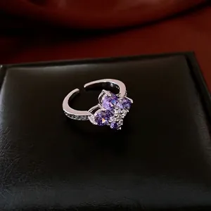Adjustable silver ring with purple zircon flower hearts and sparkly diamond micro-pave