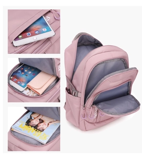 Detailed internal compartments of pink school backpack featuring a dedicated tablet sleeve
