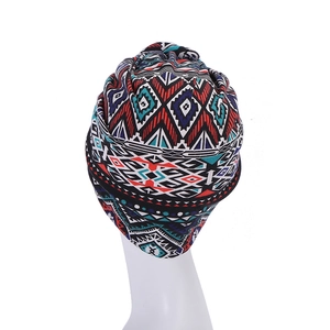 Detailed front view of polyester turban cap with colorful geometric bohemian pattern