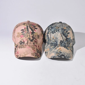 Classic floral leaf pattern baseball caps in pink and blue tones with curved brim