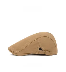 Detail view of khaki cotton newsboy cap featuring side stitching and adjustable metal buckle