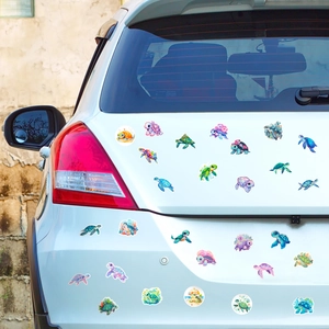Watercolour sea turtle decals applied to white car rear showing realistic application