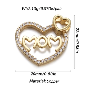 Macro shot of gold-plated heart pendant with MOM text and crystal border dimensions