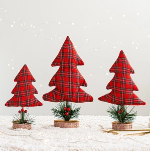 Three-piece red and green plaid Christmas tree ornaments with wooden bases and pine berries
