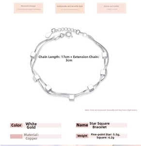 Detail view of a double-layered snake chain bracelet with cubes in polished white gold finish