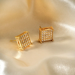 Classic gold square stud earrings with micro-paved cubic zirconia on satin background