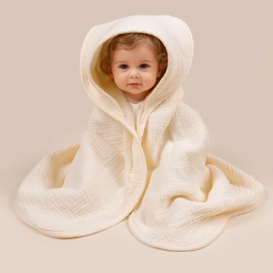 Close-up of the soft crinkle texture on a hooded cotton gauze baby bath towel