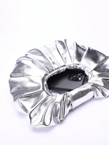 Top view of metallic silver pleated cloud clutch showing capacity for a smartphone