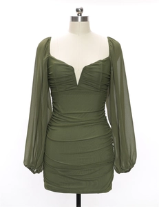 Detail of dark green mesh dress with pleated texture and stylish lantern sleeve design