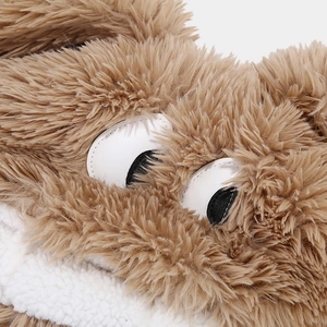 Macro detail of cute cartoon plush hat featuring brown faux fur and white sherpa fabric