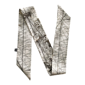 Detail of 100% silk twilly scarf featuring a vintage nautical map print on white