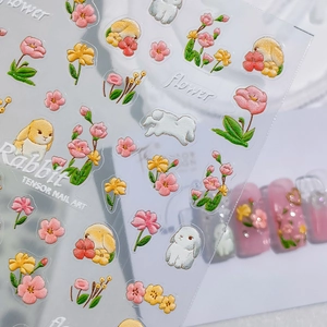 3D embossed nail art stickers featuring cute rabbits and flowers for professional manicure