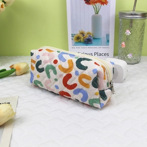 Quilted cotton pencil case with colorful geometric U-shaped pattern and zipper closure