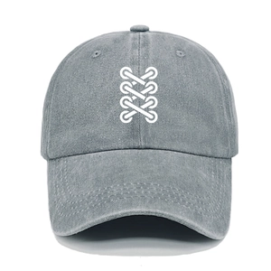 Detail of gray washed denim baseball cap featuring white shoelace graphic and curved brim