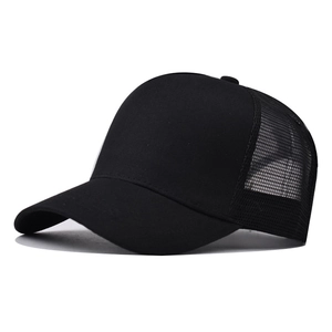 Side view of black mesh trucker hat with solid cotton front panel and curved brim