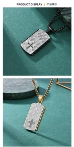 Detailed view of hammered texture pendant with cross inlay and cubic zirconia in gold and black
