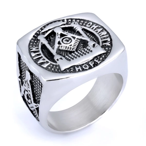 Detail of silver Masonic ring showing engraved Faith Hope Charity and compass symbol