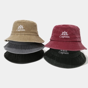Washed cotton bucket hats with Captain embroidery in various vintage colors