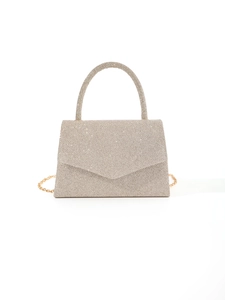 Detail of champagne gold sequined evening bag with metallic handle and chain strap