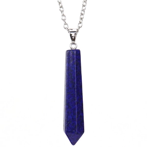 Macro shot of natural Lapis Lazuli hexagonal pillar pendant on a silver-tone chain necklace