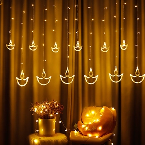 Warm yellow LED Diya curtain lights for Diwali and festive indoor home decorations