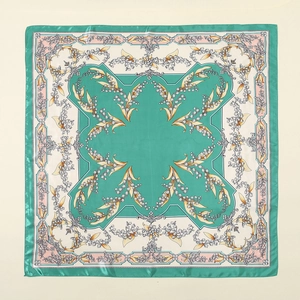 Detail of square silk scarf showing mint green lily of the valley floral patterns and texture
