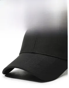 Detail of a black baseball cap featuring a stiff brim and metallic side signature logo